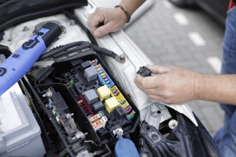 a person working on car electronics.
