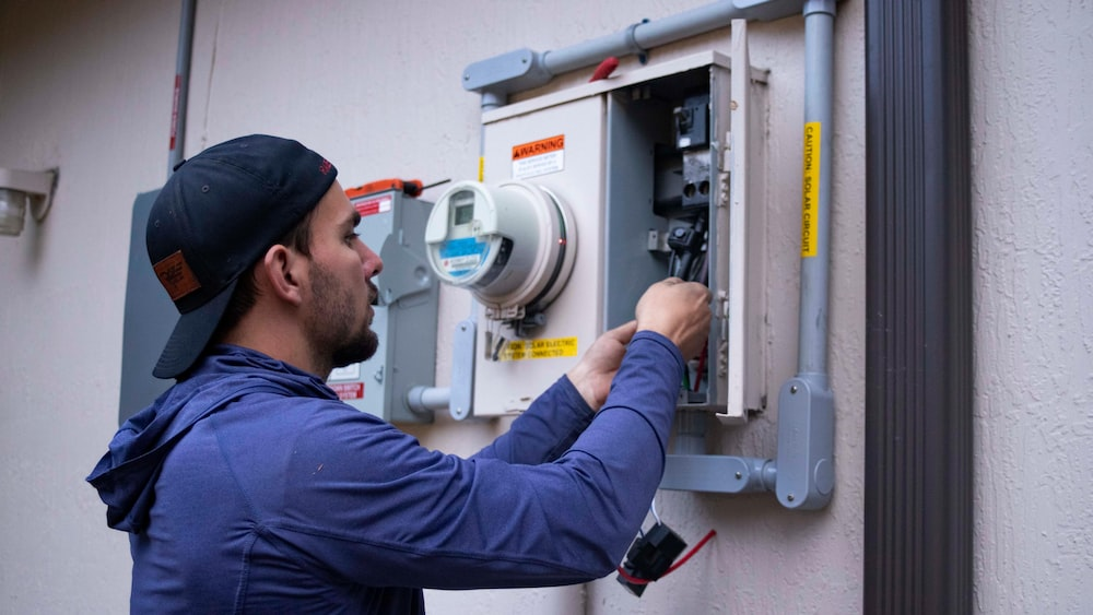  a technician checking a solar power generation system. 